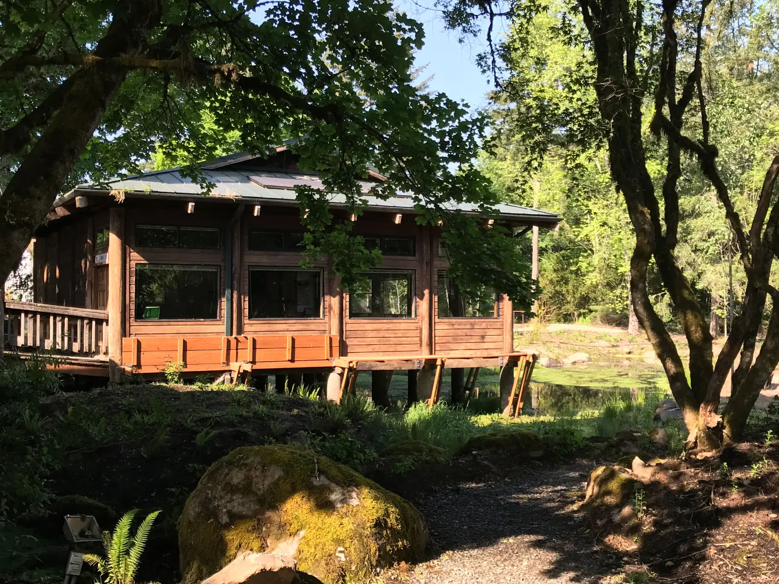 The Environmental Learning Center's Lakeside Hall, right next to a gravel path and beautiful trees